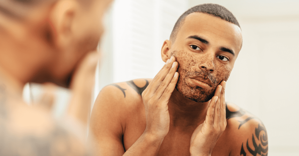 man exfoliating is one of our summer skin care tips